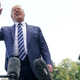 Donald Trump talks with reporters as he departs the White House July 19, 2019, for golfing at his New Jersey club.